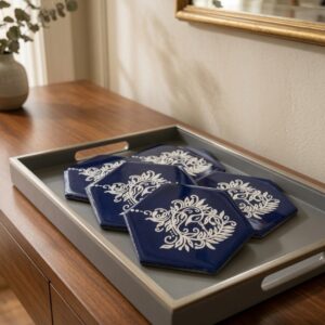 Blue coaster placed on a table in a tray